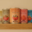 Tins of different flavour authentic Spanish tomato frito with vegetabels